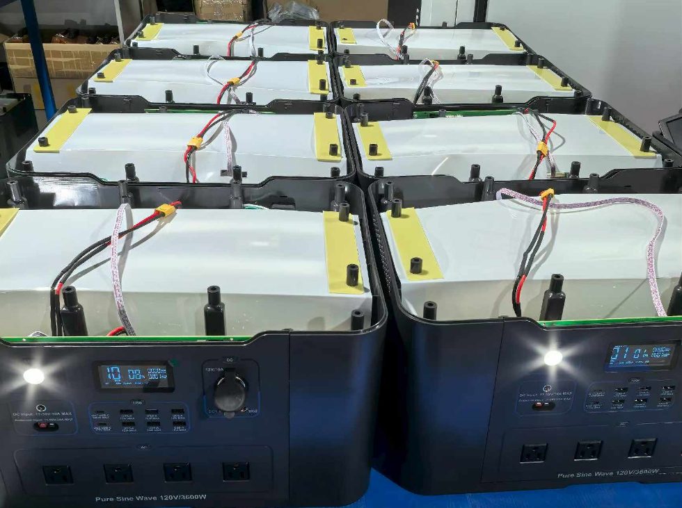 Open portable power station chassis during assembly, pure sine wave 120V/3600W with internal battery packs and wiring