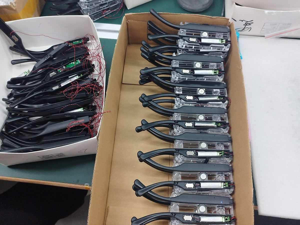 Semi-finished custom products with components arranged in production trays during an OEM ODM order in China
